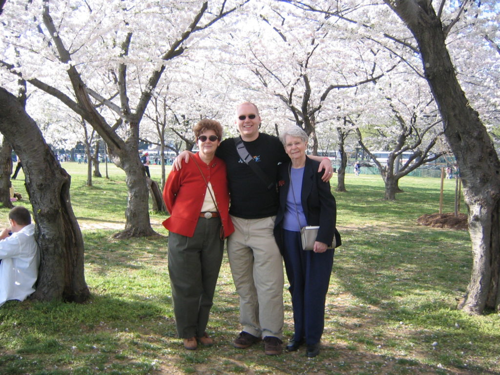 A photograph of Aunt Ann, Kevin, and Grandma under the cherry blossoms in Washington, DC.