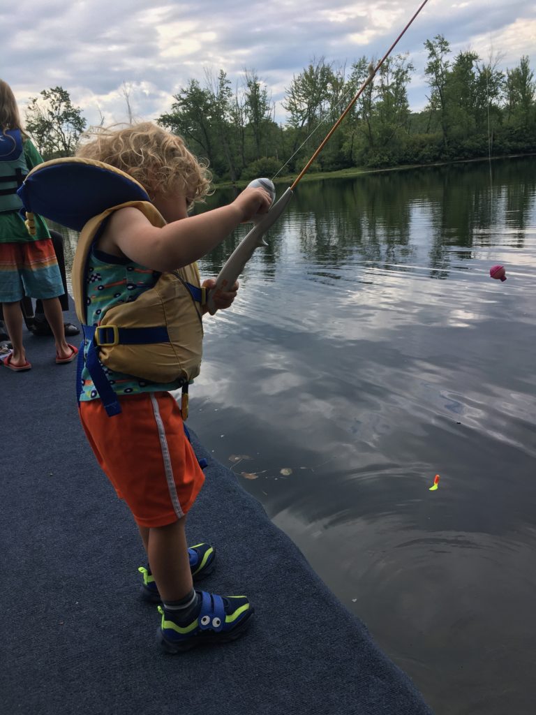 Grayson fishing off of the dock.