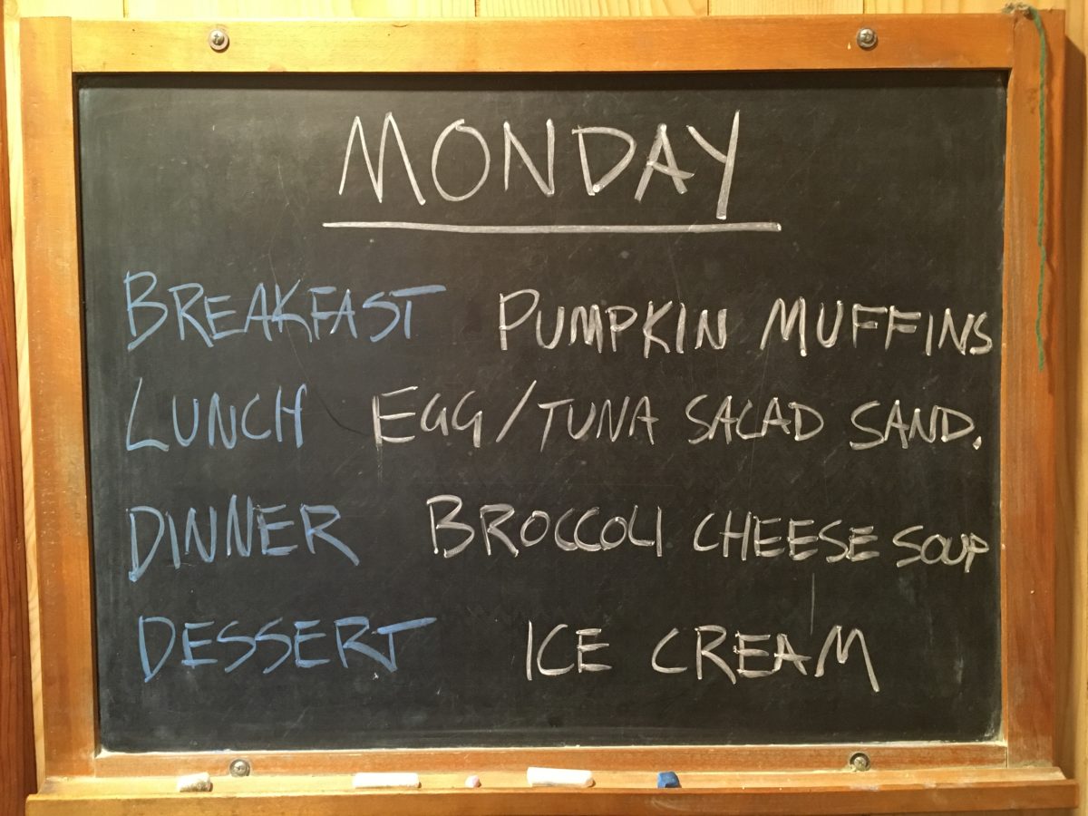 A photo of our meal board, which says Monday, breakfast, pumpkin muffins, lunch, egg or tuna salad sandwiches, dinner, broccoli cheese soup, dessert, ice cream.