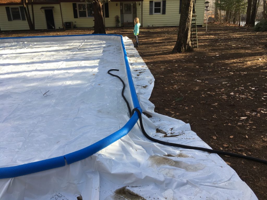 A photo of the water pipe terminating in the rink with Dillon looking on.