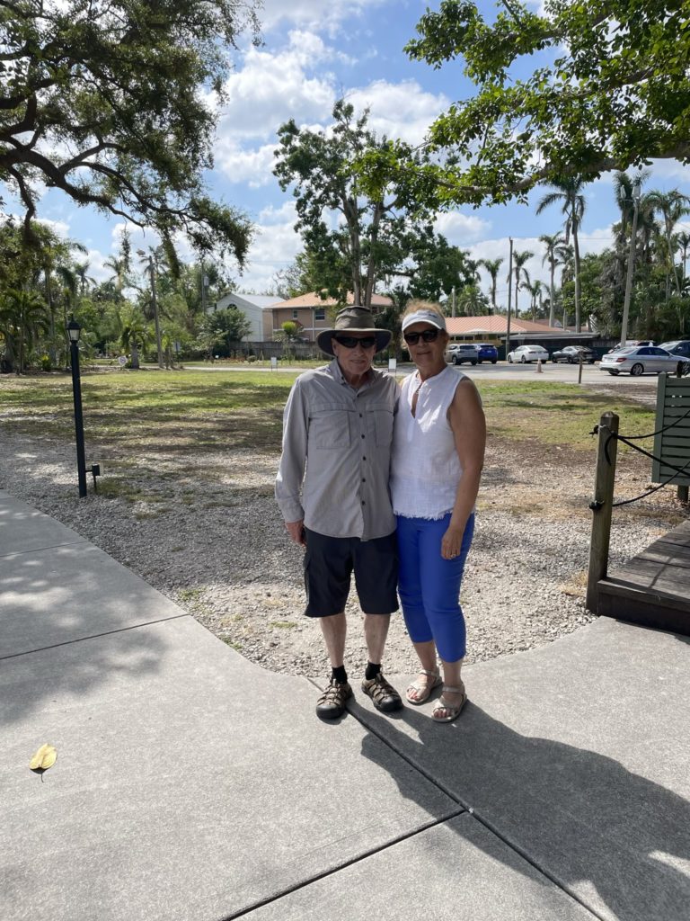 A photo of Grandpa Luke and Grammy Patty with the Edison and Ford Winter Estates buildings in the background
