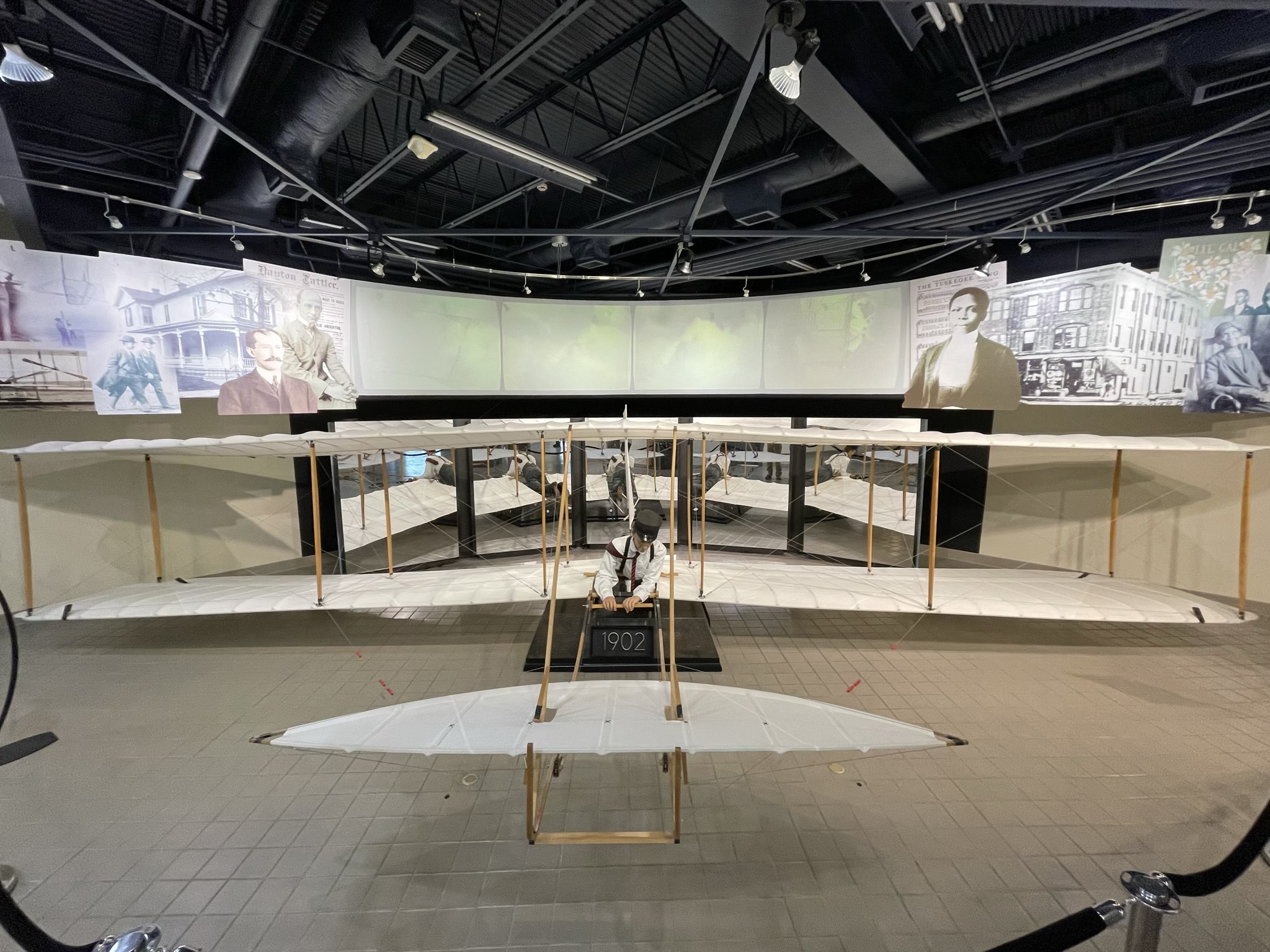 A photo of a scale reproduction of the 1902 Wright brothers glider inside the museum