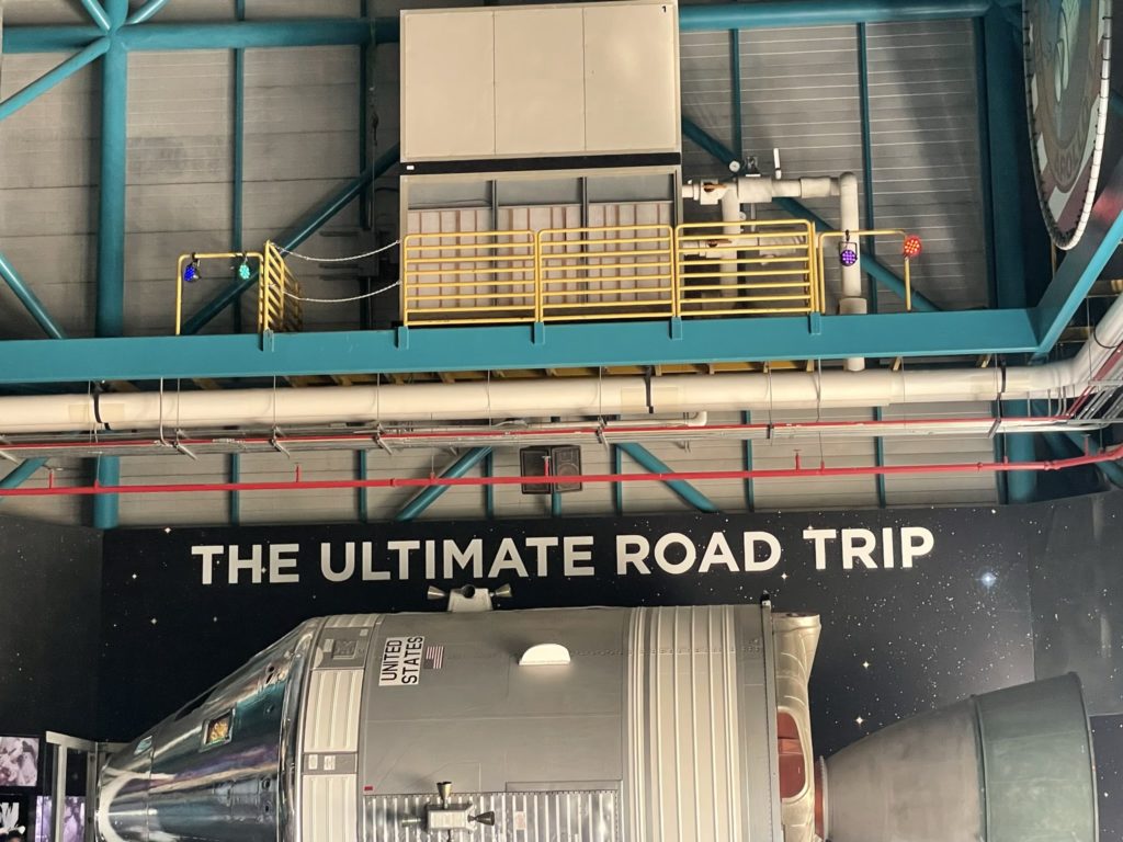 A photo of a spacecraft with the text "The Ultimate Road Trip" above it