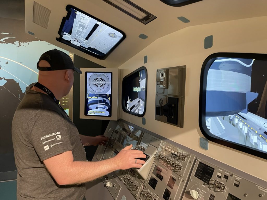 A photo of Kevin trying his hand at the docking simulator
