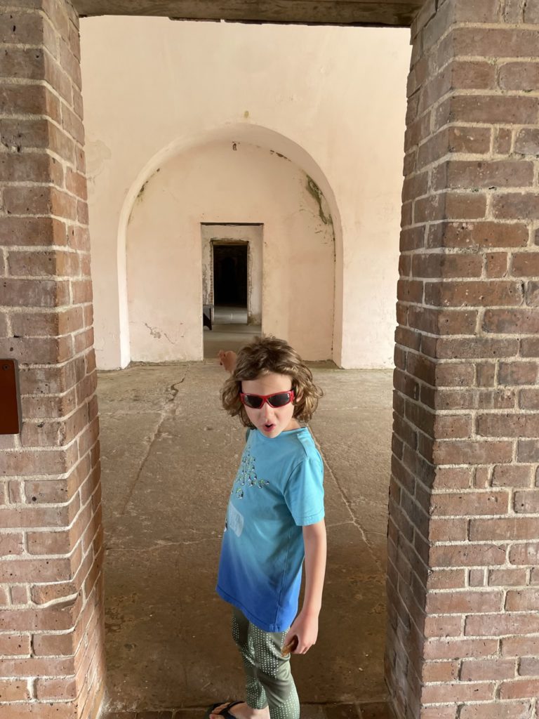A photo of Grayson striking a pose and pointing into the fort