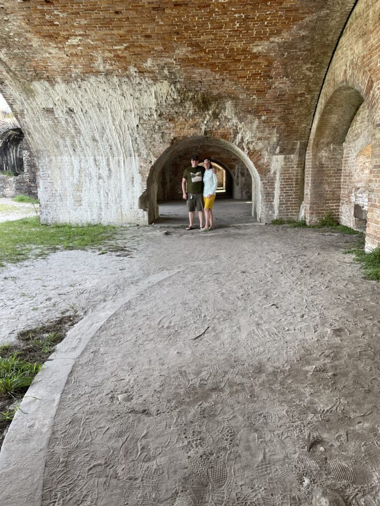 A photo of Kevin and Kelsey under one of the archways in the fort